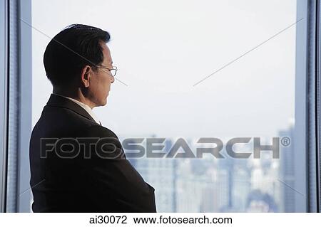 Profile of man wearing glasses looking out the window View Large Photo Image Stock Image - Profile of man wearing glasses looking out the window. Fotosearch