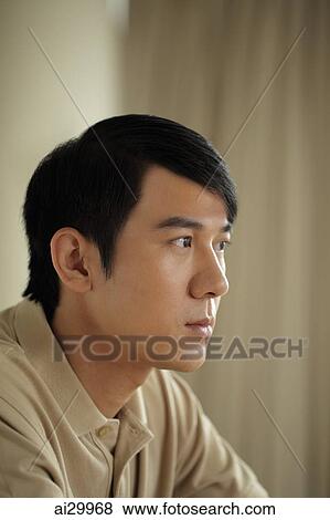 Profile of young man looking sad View Large Photo Image Stock Photo - Profile of young man looking sad. Fotosearch