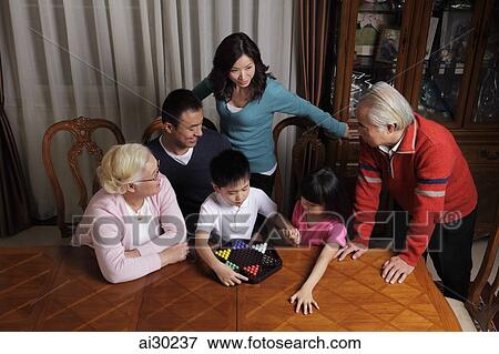 Three generation family playing Chinese checkers together View Large Photo Image Stock Photo - Three generation family playing Chinese checkers together. Fotosearch