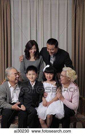 Three generation family smiling at each other View Large Photo Image Stock Image - Three generation family smiling at each other. Fotosearch