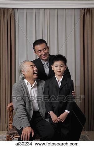 Picture - Three generation portrait of grandfather, father and son. Fotosearch