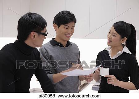 Stock Photo - Three people talking in office. Fotosearch