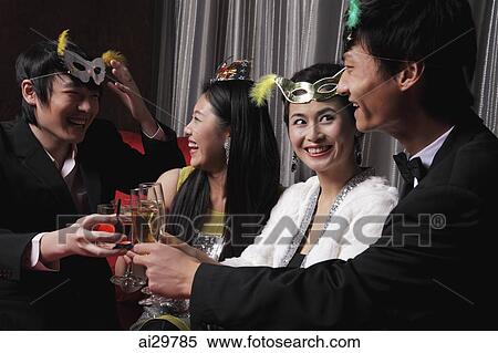 Two couples celebrating at a party together View Large Photo Image Stock Photography - Two couples celebrating at a party together. Fotosearch