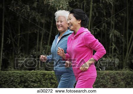 Two older women jogging together View Large Photo Image Stock Image - Two older women jogging together. Fotosearch