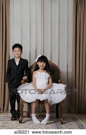 Young boy and girl dressed up in nice clothes smiling View Large Photo Image Stock Image - Young boy and girl dressed up in nice clothes smiling. Fotosearch