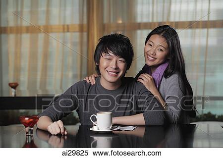 Young couple at cafe smiling View Large Photo Image Stock Photography - Young couple at cafe smiling. Fotosearch