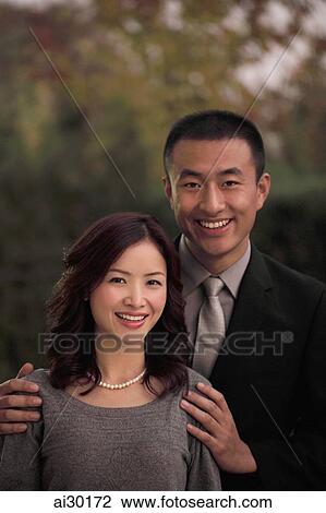 Young couple dressed up and smiling View Large Photo Image Stock Image - Young couple dressed up and smiling. Fotosearch