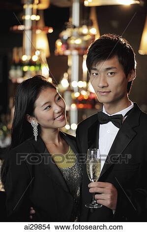 Young couple dressed up in a club at night View Large Photo Image Picture - Young couple dressed up in a club at night. Fotosearch