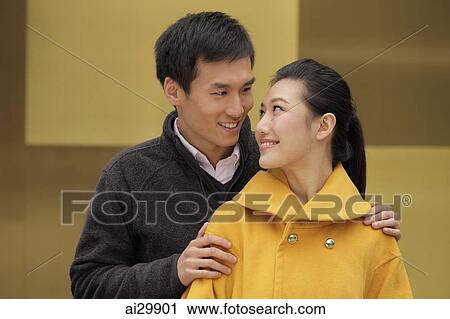 Young couple looking at eachother View Large Photo Image Stock Image - Young couple looking at eachother. Fotosearch