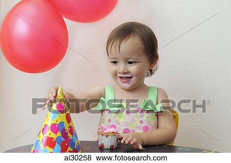 Young girl at birthday party View Large Photo Image Stock Photo - Young girl at birthday party. Fotosearch