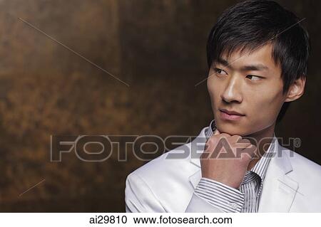 Young man in white coat View Large Photo Image Stock Image - Young man in white coat. Fotosearch