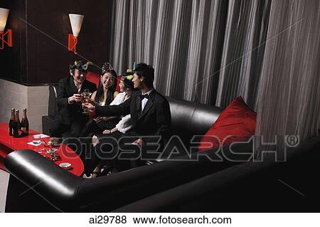 Young people celebrating in a club View Large Photo Image Stock Photo - Young people celebrating in a club. Fotosearch