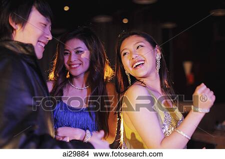 Picture - Young people dancing at night. Fotosearch