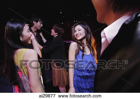Young people dancing on dance floor at night View Large Photo Image Stock Photo - Young people dancing on dance floor at night. Fotosearch