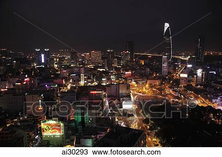Stock Image - Aerial view at night of Ho Chi Minh city with Bitexco Financial Tower in the background, Vietnam. Fotosearch