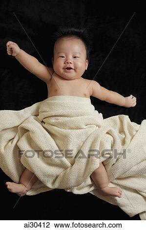 Baby boy wrapped in a blanket View Large Photo Image Stock Image - Baby boy wrapped in a blanket. Fotosearch
