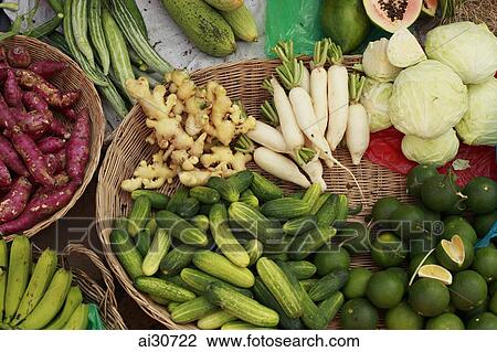 Baskets of different fruits and vegetables being sold in a street market. Siem Reap, Cambodia View Large Photo Image Stock Image - Baskets of different fruits and vegetables being sold in a street market. Siem Reap, Cambodia. Fotosearch