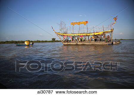 Stock Photo - Boats floating in the river, Siem Reap, Cambodia. Fotosearch