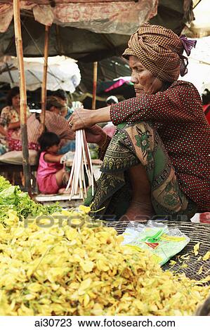 Cambodian women selling vegetables in market. Siem Reap, Cambodia View Large Photo Image Stock Image - Cambodian women selling vegetables in market. Siem Reap, Cambodia. Fotosearch