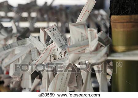 Close up of Omikuji fortunes tied together, Shinjuku Park Shrine, Japan View Large Photo Image Stock Photo - Close up of Omikuji fortunes tied together, Shinjuku Park Shrine, Japan. Fotosearch