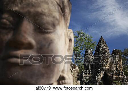 Close up of statue in front of Bayon Temple, Angkor Wat, Cambodia View Large Photo Image Stock Photo - Close up of statue in front of Bayon Temple, Angkor Wat, Cambodia. Fotosearch