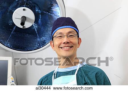 Closeup of doctor in operating room wearing scrubs View Large Photo Image Picture - Closeup of doctor in operating room wearing scrubs. Fotosearch