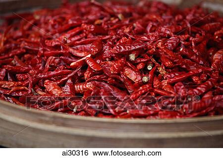 Dried red chillies in a woven basket View Large Photo Image Stock Photograph - Dried red chillies in a woven basket. Fotosearch