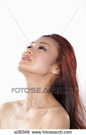 Head shot of woman with long hair looking up View Large Photo Image Stock Photo - Head shot of woman with long hair looking up. Fotosearch