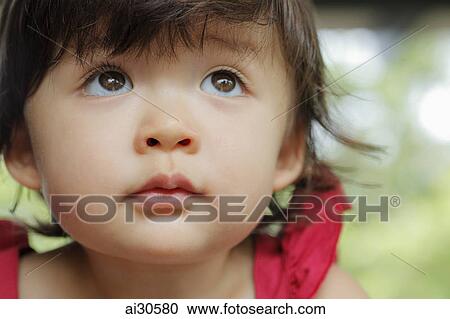 Head shot of young girl looking up View Large Photo Image Stock Image - Head shot of young girl looking up. Fotosearch