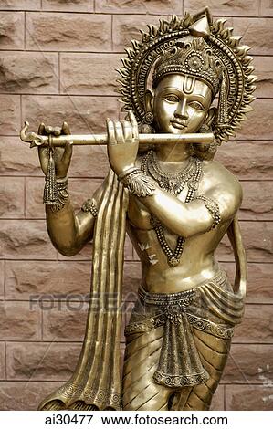 Indian bronze sculpture of a deity playing a flute, New Delhi, India View Large Photo Image Stock Photo - Indian bronze sculpture of a deity playing a flute, New Delhi, India. Fotosearch