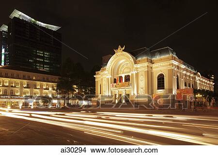 Lights stream from traffic in front of the Hotel Continental and Saigon Opera House, Ho Chi Minh, Vietnam View Large Photo Image Picture - Lights stream from traffic in front of the Hotel Continental and Saigon Opera House, Ho Chi Minh, Vietnam. Fotosearch