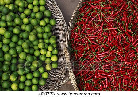 Limes and red chillies in woven baskets. View Large Photo Image Stock Image - Limes and red chillies in woven baskets.. Fotosearch