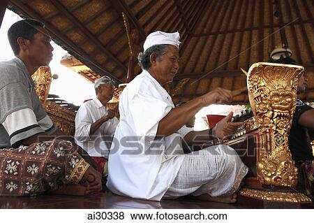 Men playing traditional musical instruments. Indonesia, Bali View Large Photo Image Stock Photo - Men playing traditional musical instruments. Indonesia, Bali. Fotosearch