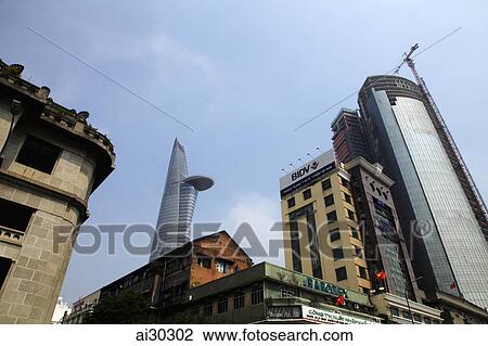 Old and new buildings with Bitexco Financial Tower in background. Ho Chi Minh, Vietnam View Large Photo Image Stock Image - Old and new buildings with Bitexco Financial Tower in background. Ho Chi Minh, Vietnam. Fotosearch