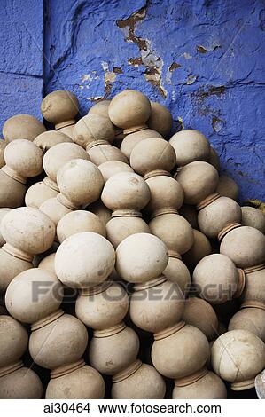 Pile of clay pots against a blue wall, Jodhpur, India View Large Photo Image Picture - Pile of clay pots against a blue wall, Jodhpur, India. Fotosearch