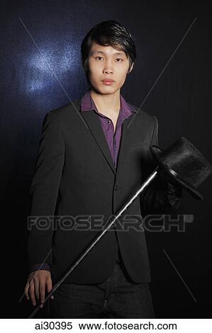 Portrait of a magician with his magic wand and hat View Large Photo Image Stock Photography - Portrait of a magician with his magic wand and hat. Fotosearch