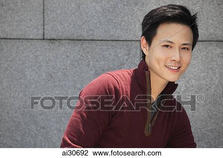 Stock Image - Portrait of young man smiling. Fotosearch