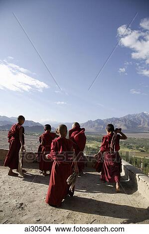 Rear view of young monks looking at the view, Likir Monastery, Ladakh, India View Large Photo Image Picture - Rear view of young monks looking at the view, Likir Monastery, Ladakh, India. Fotosearch