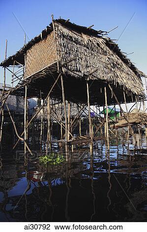 Stilt houses on a river, Siem Reap, Cambodia View Large Photo Image Stock Image - Stilt houses on a river, Siem Reap, Cambodia. Fotosearch