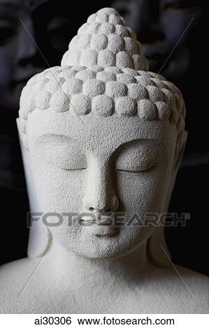 Stone carving of Buddha's head View Large Photo Image Stock Photograph - Stone carving of Buddha's head. Fotosearch