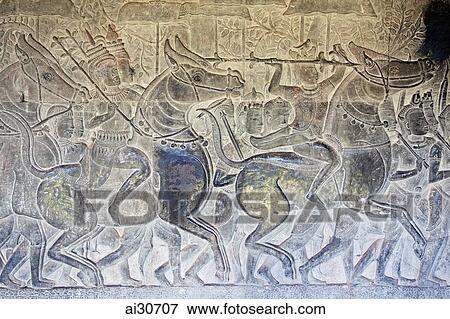 Stock Photo - Stone carving on a wall in Angkor Wat, Cambodia. Fotosearch