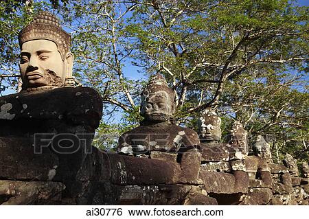 Stone carvings of deities, Angkor Wat, Cambodia View Large Photo Image Stock Photograph - Stone carvings of deities, Angkor Wat, Cambodia. Fotosearch