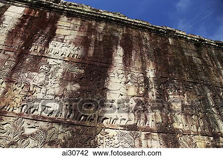 Stone carvings on wall of Bayon Temple, Angkor Wat, Cambodia View Large Photo Image Stock Image - Stone carvings on wall of Bayon Temple, Angkor Wat, Cambodia. Fotosearch