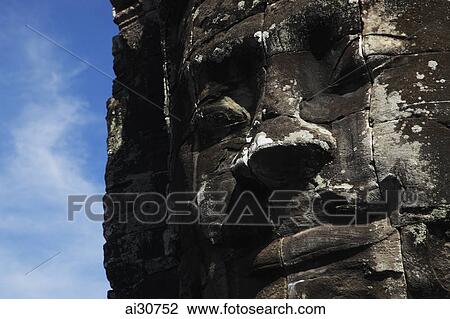 Stock Image - Stone face of Bayon Temple, Angkor Wat, Cambodia. Fotosearch