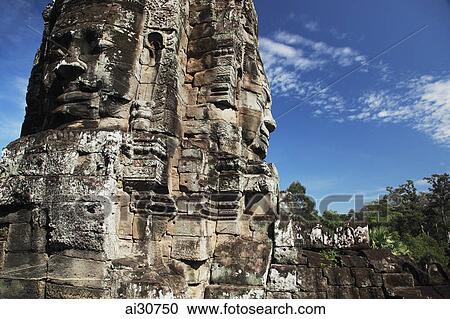 Stone faces of Bayon Temple, Angkor Wat, Cambodia View Large Photo Image Stock Image - Stone faces of Bayon Temple, Angkor Wat, Cambodia. Fotosearch