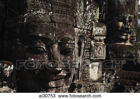 Stock Image - Stone faces of Bayon Temple, Angkor Wat, Cambodia. Fotosearch