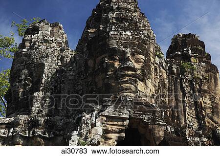 Stone faces of Bayon Temple, Angkor Wat, Cambodia View Large Photo Image Stock Image - Stone faces of Bayon Temple, Angkor Wat, Cambodia. Fotosearch