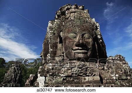 Stock Photo - Stone faces of Bayon Temple, Angkor Wat, Cambodia. Fotosearch