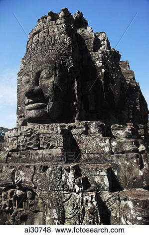 Stock Photo - Stone faces of Bayon Temple, Angkor Wat, Cambodia. Fotosearch