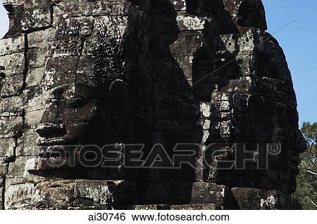 Stone faces of Bayon Temple, Angkor Wat, Cambodia View Large Photo Image Stock Photograph - Stone faces of Bayon Temple, Angkor Wat, Cambodia. Fotosearch